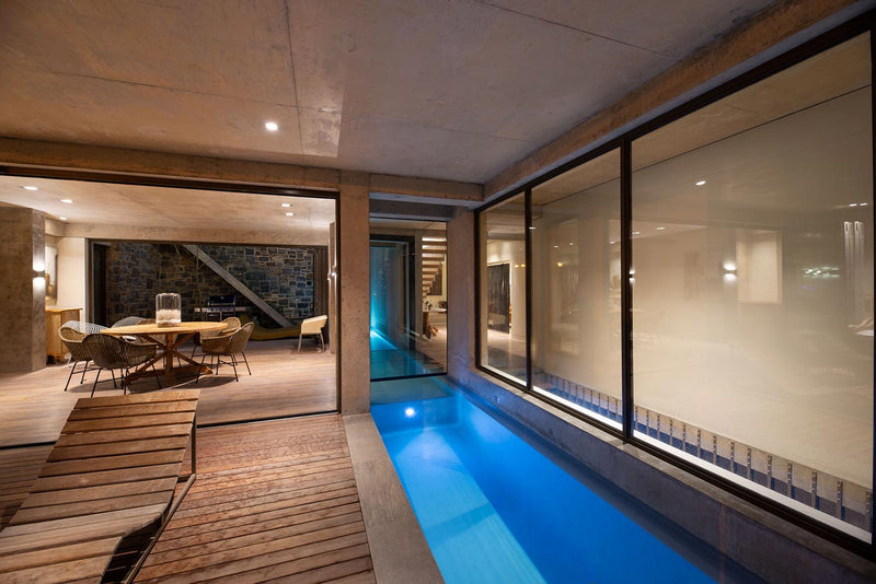 Modern interior shot of villa courtyard with indoor pool.