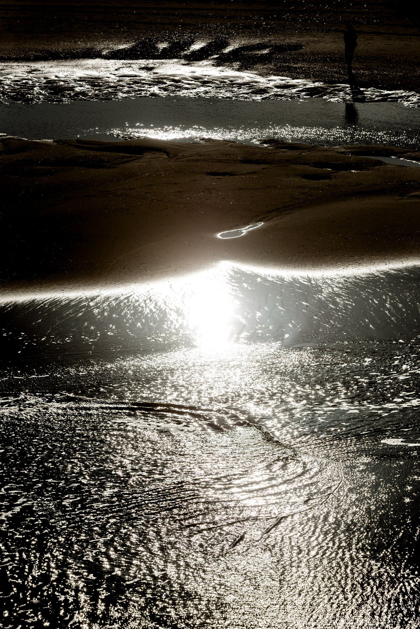 An abstact view of a walker on Scheveningen beach.