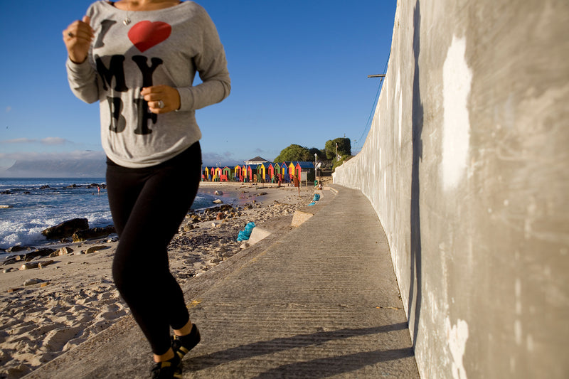 A woman jogging near St James, Cape Town.