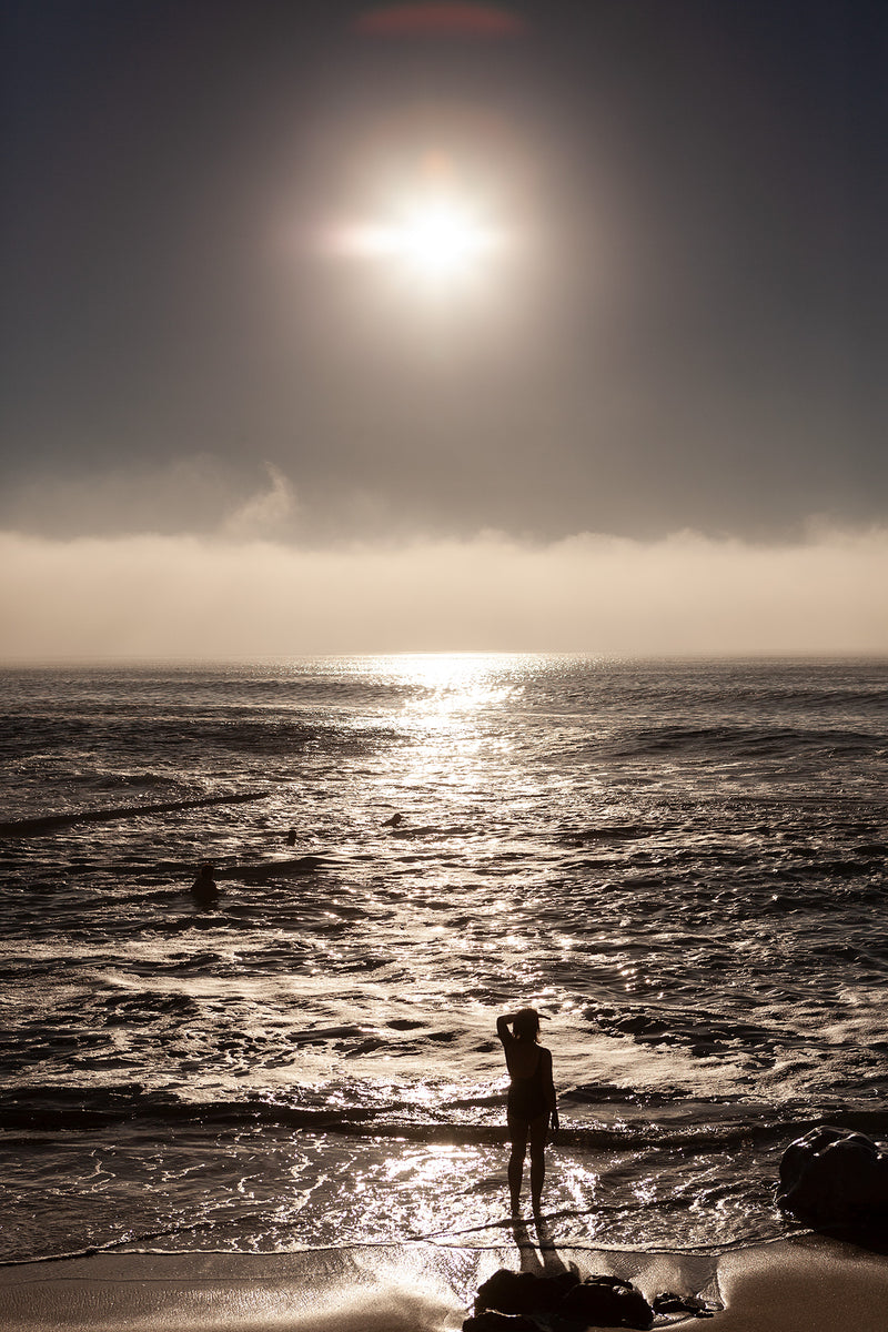 A swimmer enters the water at St James tidal pool, Cape Town.