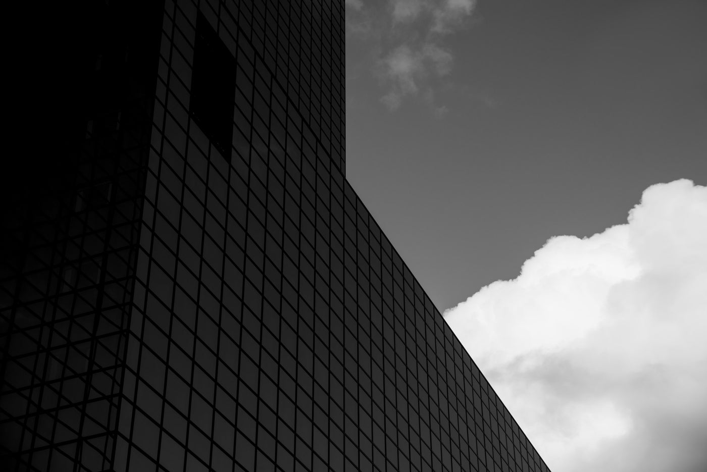 The Delftse Poort building in Rotterdam against the pale grey sky.
