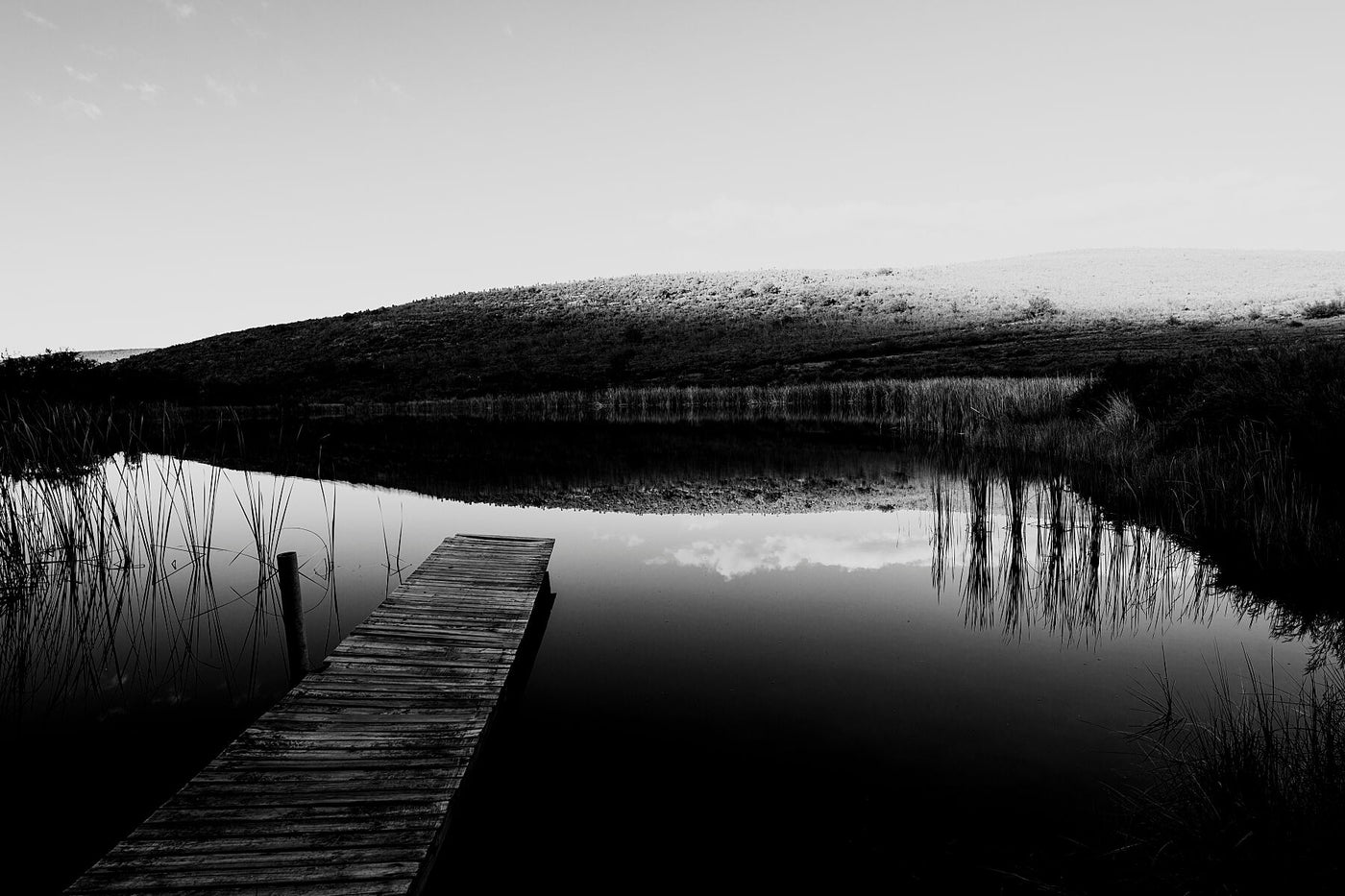 A farm dam and jetty in an emotive karoo landscape