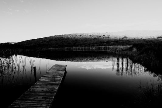 A farm dam and jetty in an emotive karoo landscape