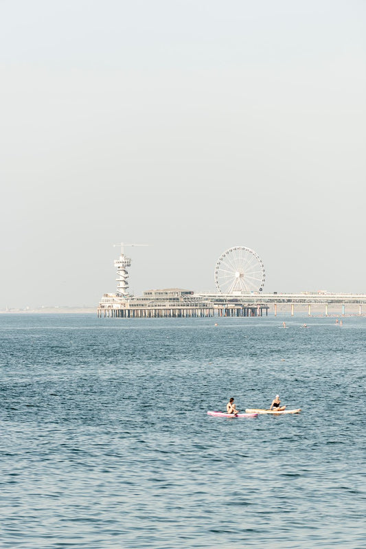 Paddle boarders float in the North Sea near Scheveningen.