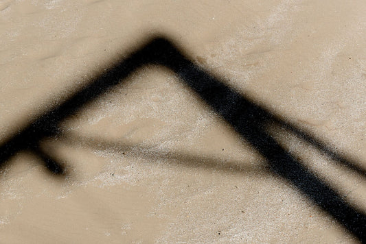 A shadow cast by the Bungee Jumping Crane on the beach at Scheveningen.