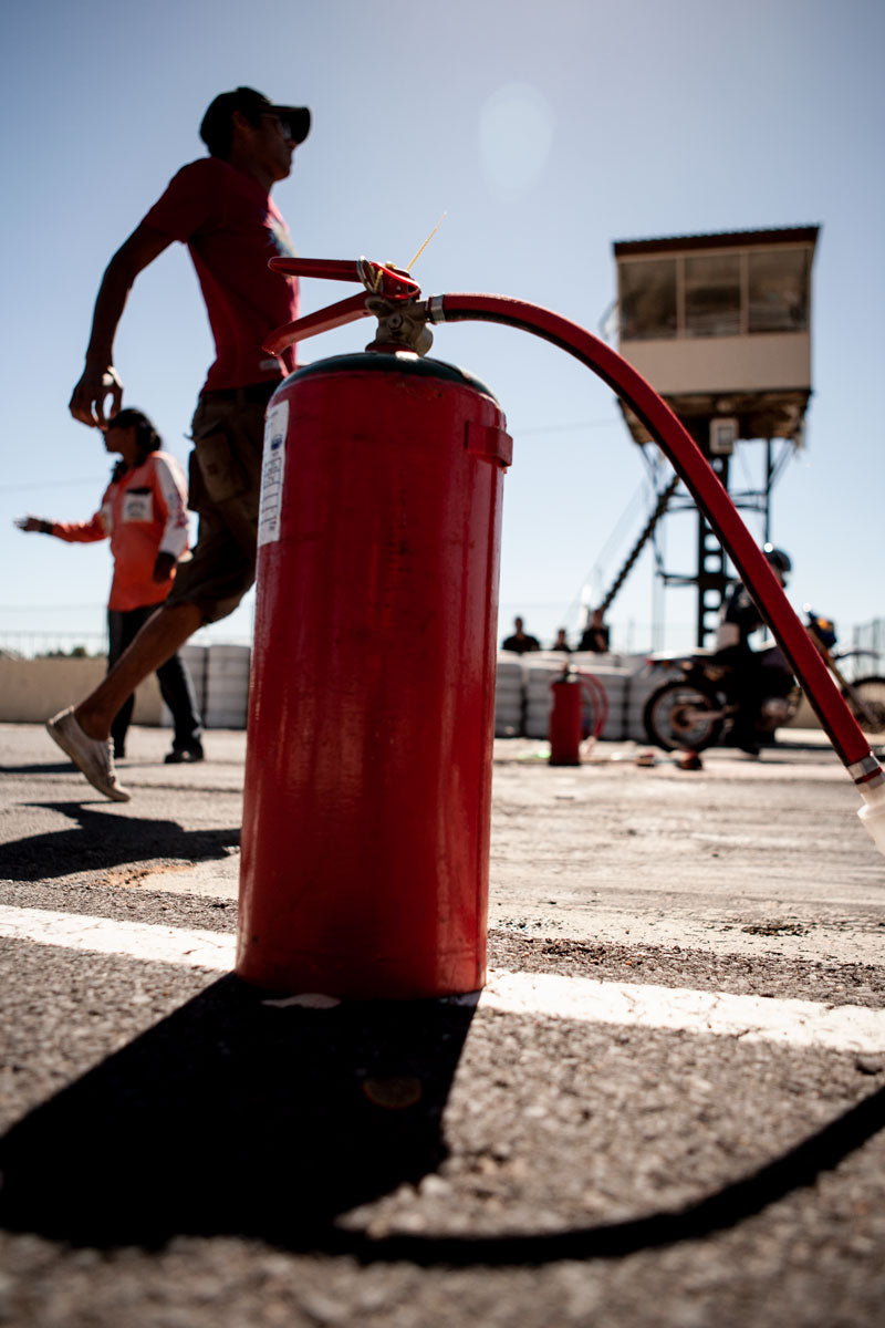 Safety marshall and equipment at an amateur drag racing event.