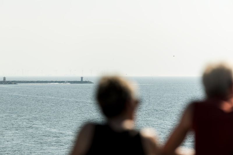 Two grannies looking toward the harbour from the pier at Scheveningen