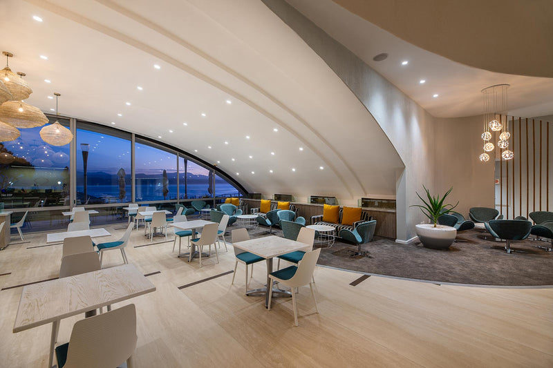 Hotel interior photographed at twilight.