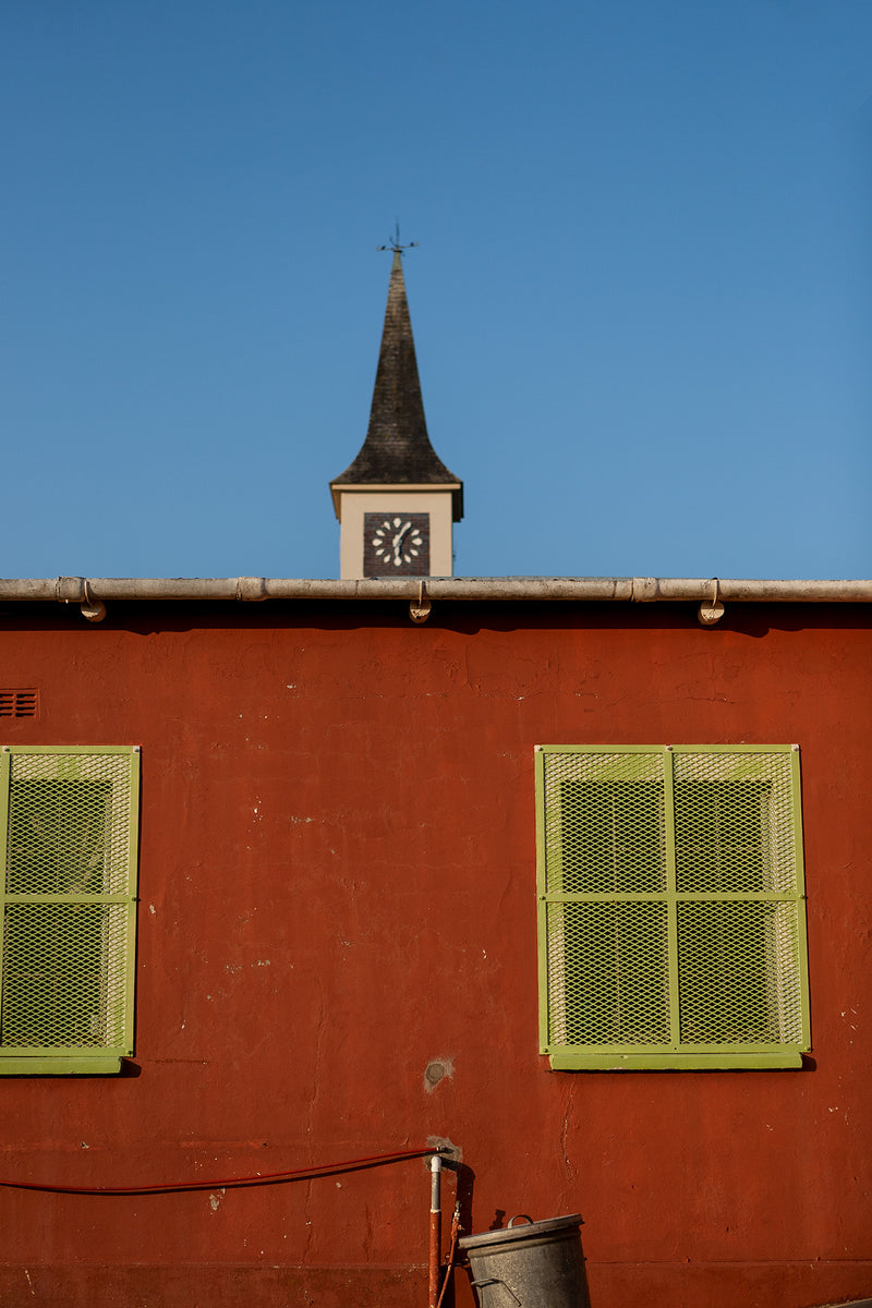 A graphic image of a wall and a church.