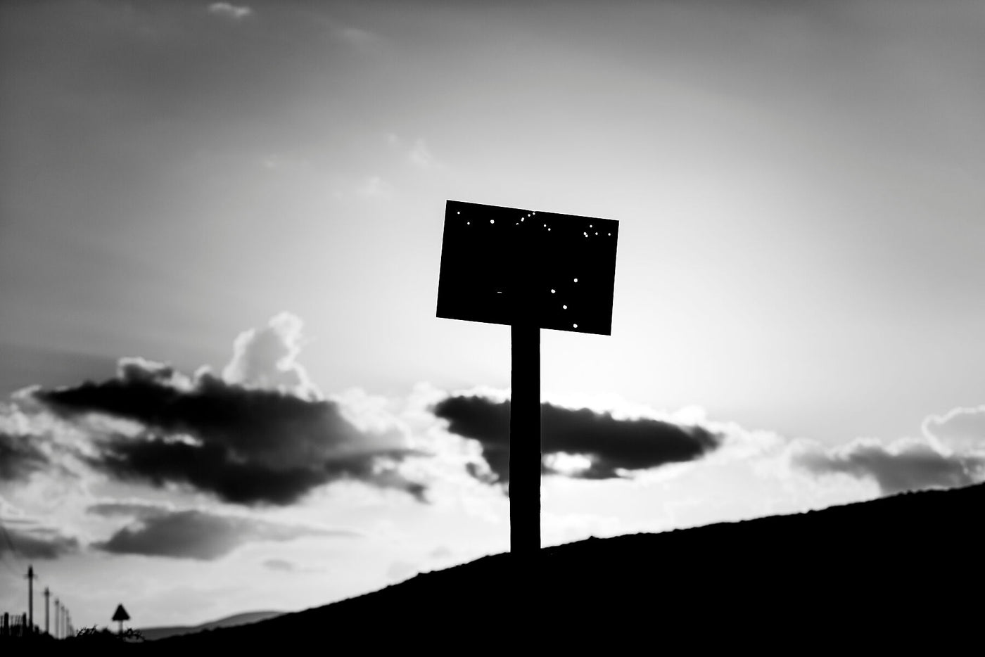 A shot up signboard depicted in this Karoo fine art print.