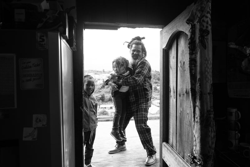 A family in a doorway in South Africa.
