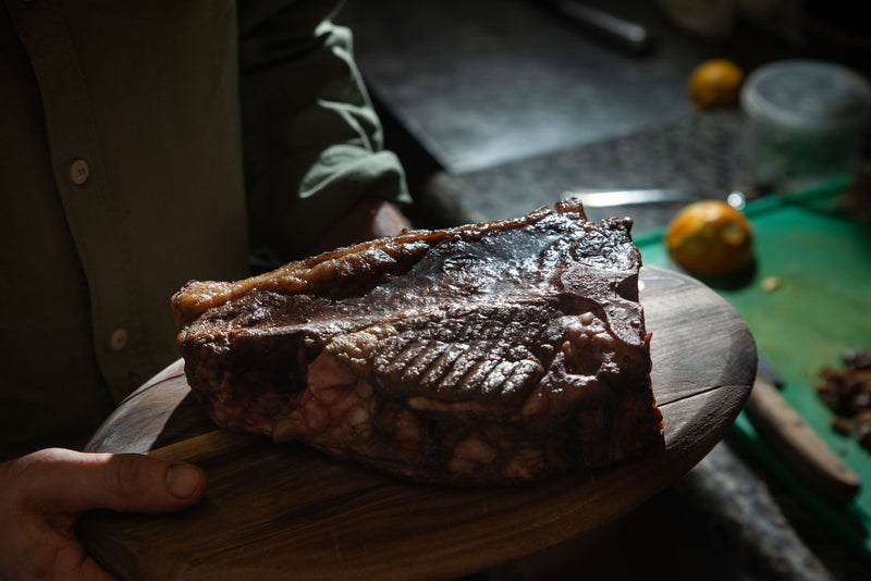 A cut of meat in a restaurant kitchen.