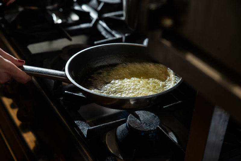 Butter cooking in a pan.