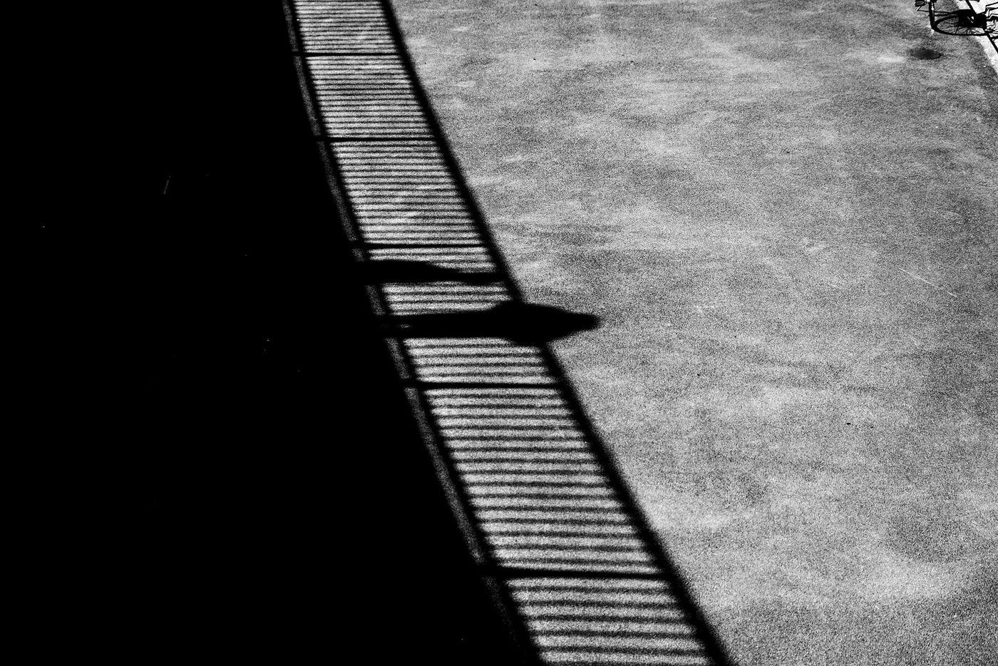 A detail shot showing a shadow on concrete at the Erasmusbrug in Rotterdam