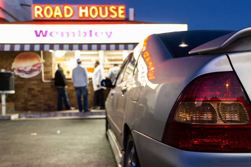 Reportage photograph of a a car parked outside the Wembley Road House.