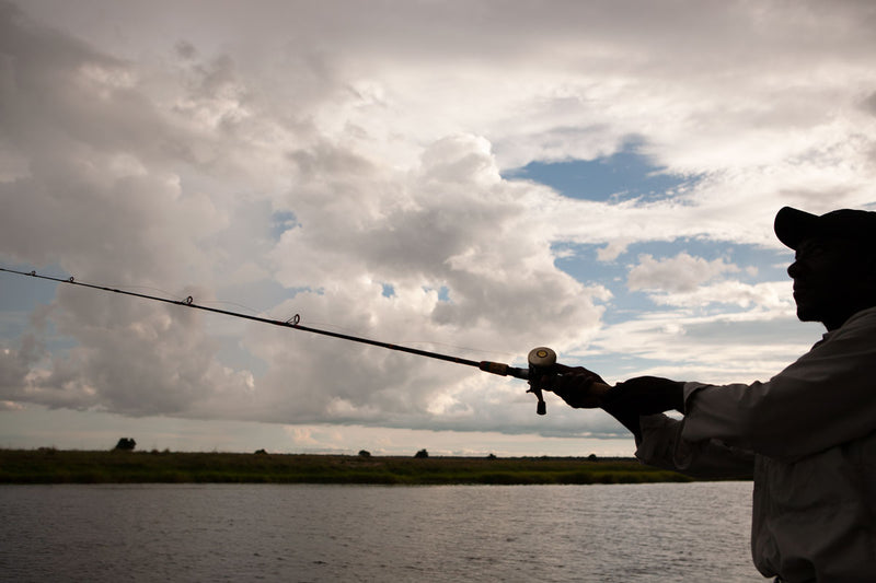 Man fishing on the banks of the Zambezi