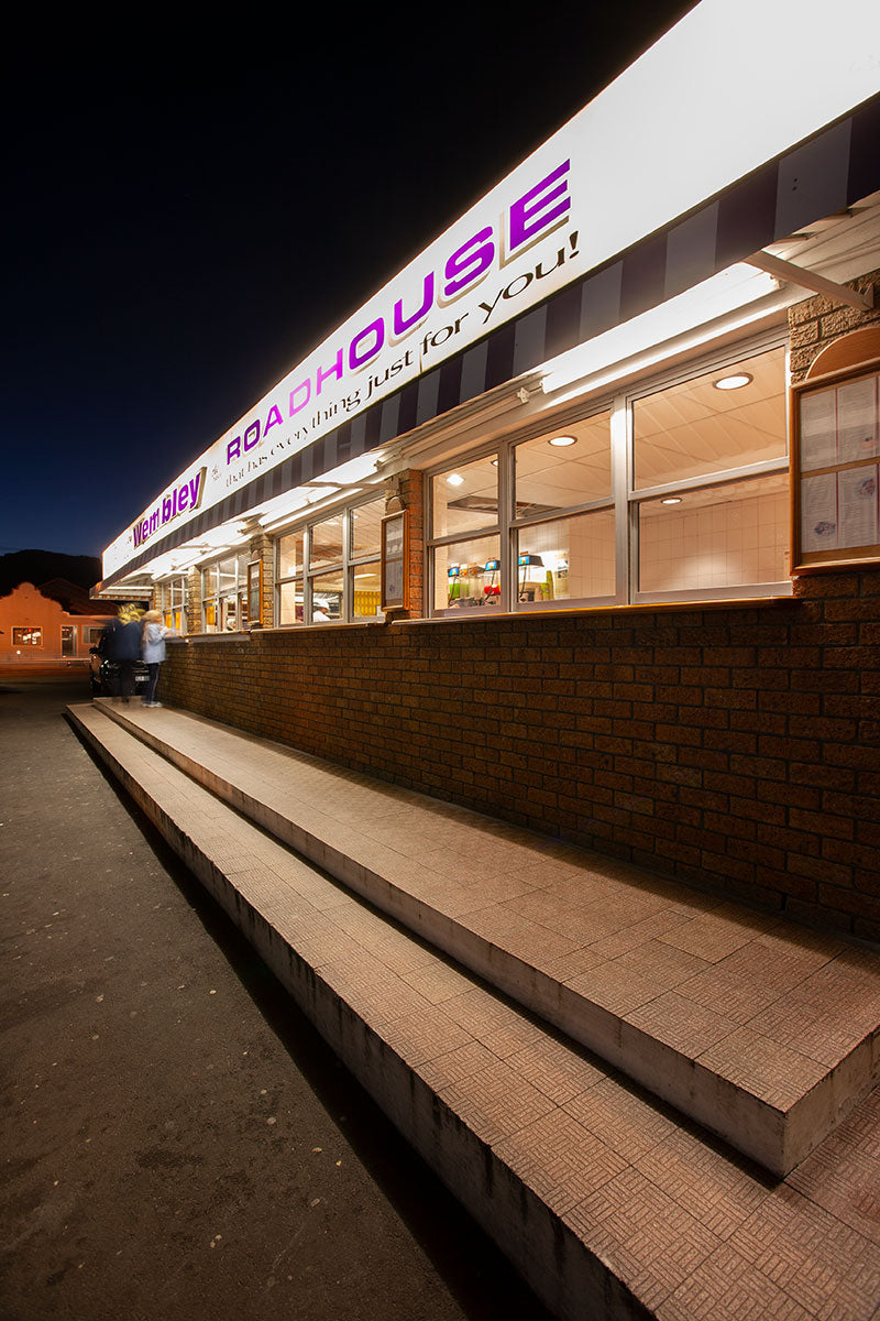 Twilight architectural exterior of road house for travel editorial feature.